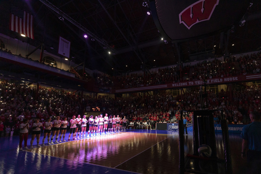 Fans turn on their phone flashlights to add to the atmosphere during lineup announcements before the game against Pitt.