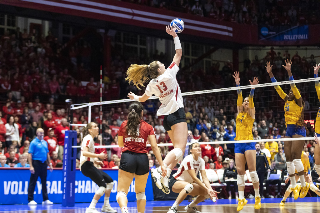 Sarah Franklin (#13) spikes the ball on Saturday.