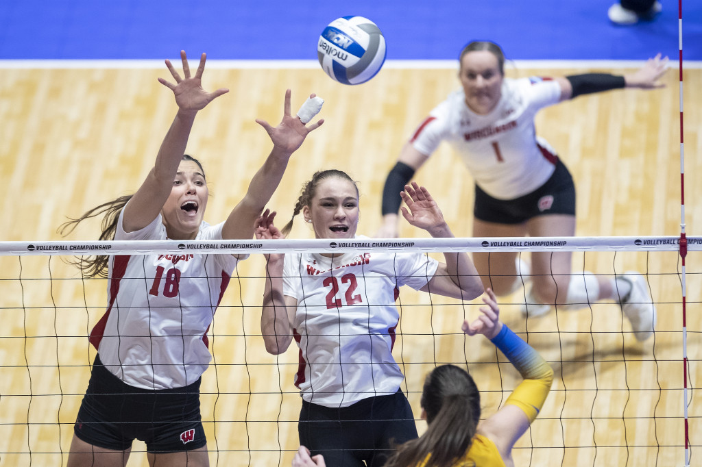 Danielle Hart (#18) and Julia Orzol (#22) go up for a block.