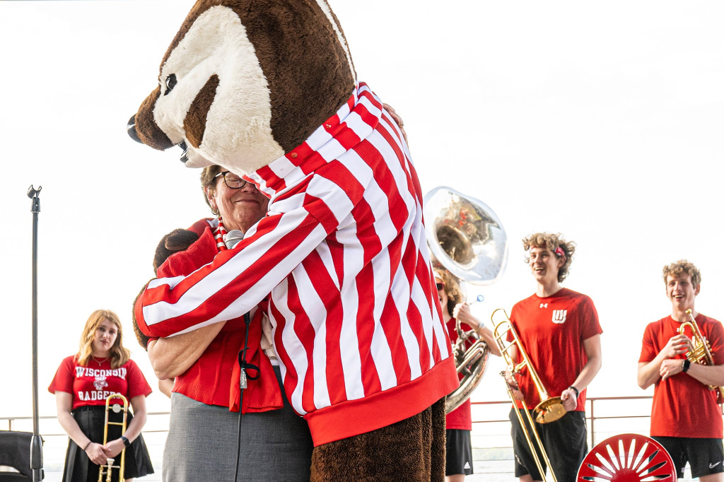 Bucky Badger embraces Chancellor Rebecca Blank in a hug at the Memorial Union Terrace.