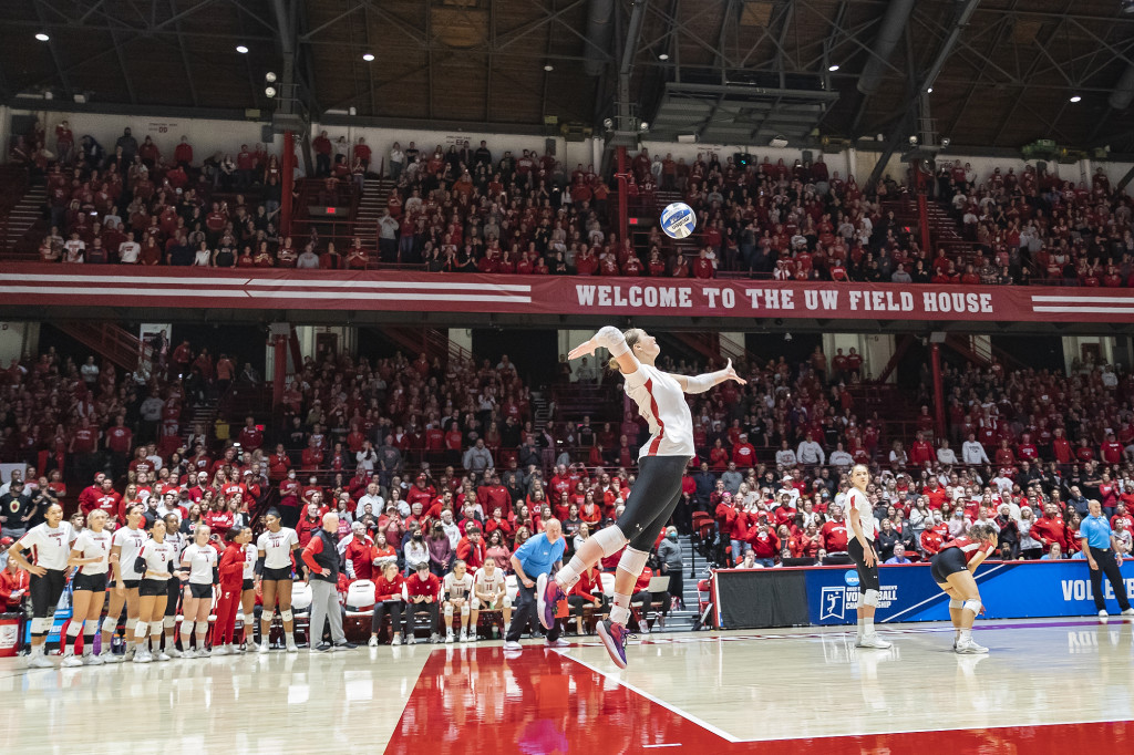 MJ Hammill (#6) serves against TCU.