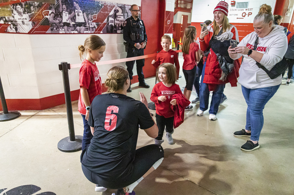 MJ Hammill (#6) talks to a young fan after the TCU match.