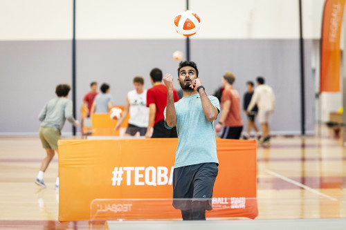 Alexander John heads the teqball toward the other team.