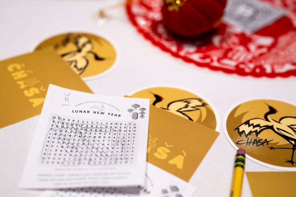 A crossword puzzle and other themed-decorations adorn a table during the CHASA celebration.