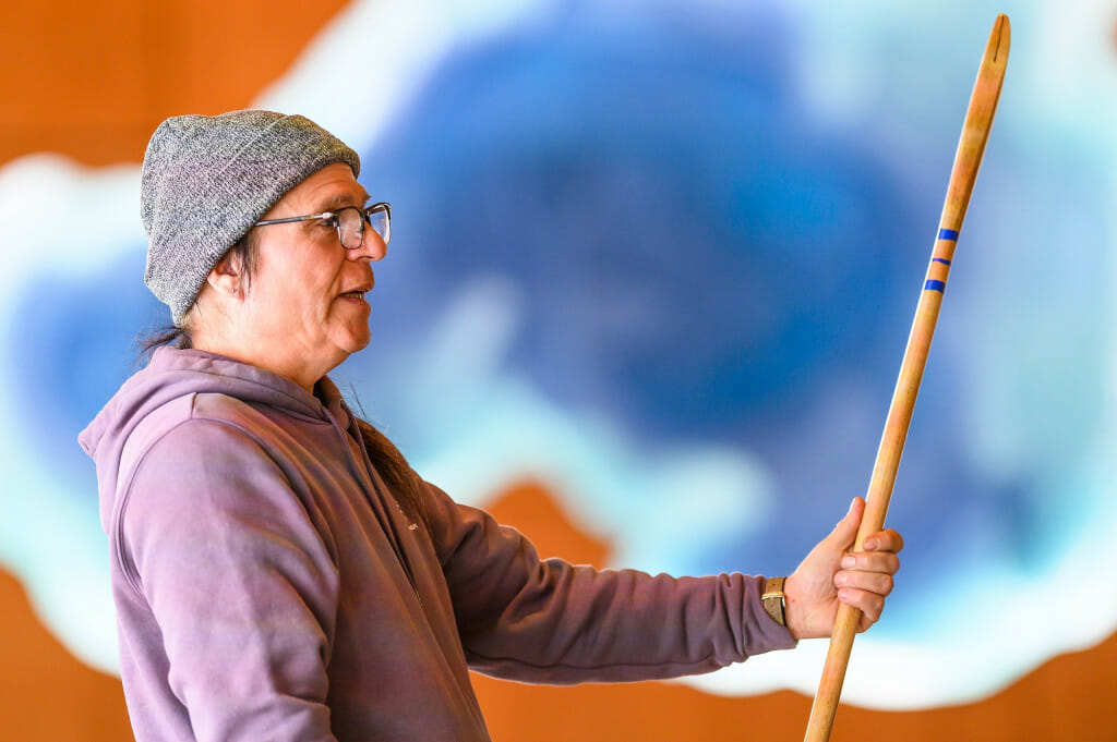 Wayne Valliere, an Ojibwe language and culture teacher at the Lac du Flambeau Public School, introduces participants to the Ojibwe Winter Games in the Mendota Room at Dejope Residence Hall. Valliere, whose native name is Mino-giizhig, holds a snow snake and describes how the winter games taught children at a very young age how to throw and push so as they came of age they would have necessary hunting skills.