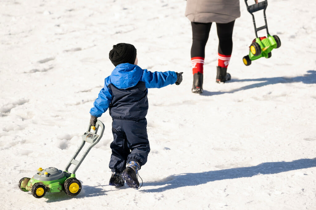 There wasn't much grass to be mowed, but this youngster thought it was best to be prepared.