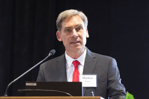 Markus Brauer speaks from a lectern