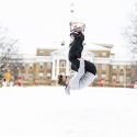 Student A.J. Beery catches some air while snowboarding on Bascom Hill.