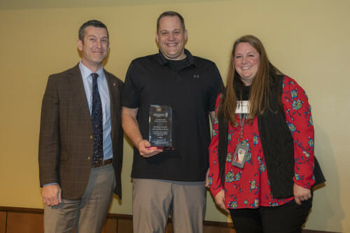 Pictured (L-R): Patrick Sheehan, Mark Silbernagel, Tracey Berman. The three stand facing the camera and smiling.