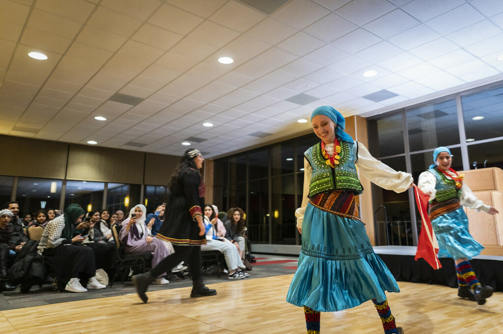 Students Ece Kilic (front), Melisa Erman (right),  represented Turkey, and Story Wardak (left) represented Afghanistan in the fashion show.