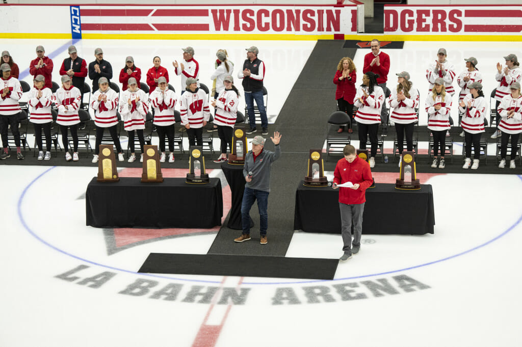 Head coach Mark Johnson waves to the crowd. 