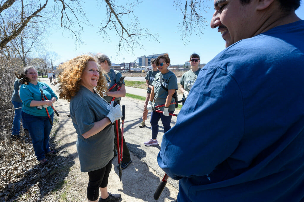 At center, Chancellor Jennifer Mnookin talks with volunteers during Bucky’s Big Event.