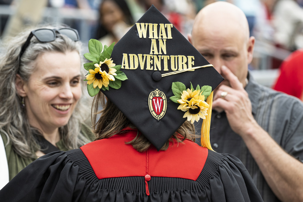 A mortarboard cap reads 