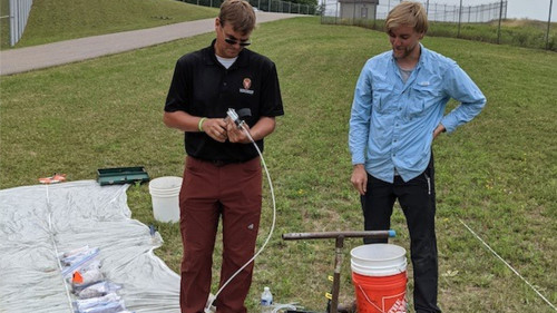 Jim Tinjum and Elliot Draxler doing field work