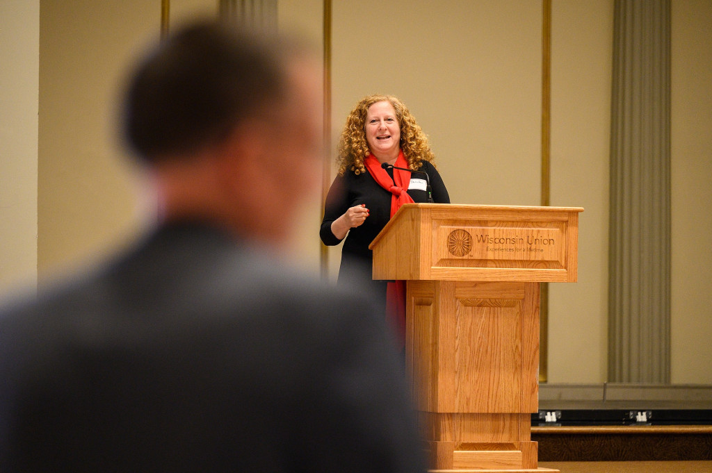 Jennifer Mnookin smiles as she speaks from a lectern.