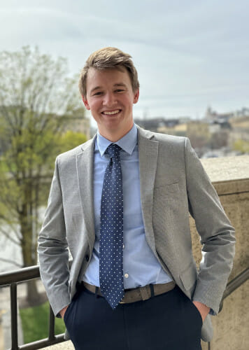 A portrait photo of Cole Roecker standing outdoors.