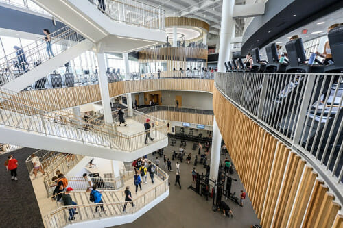 A view of the massive Bakke Center atrium, with four levels looking out onto an open area.