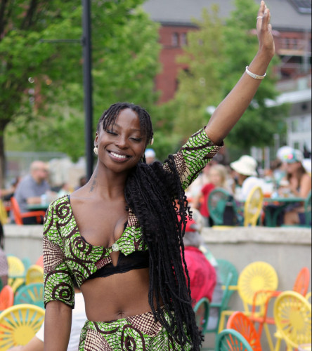 A woman waves.