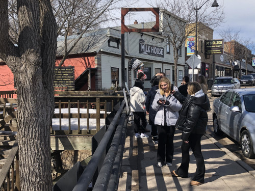 Students walk through a park area.