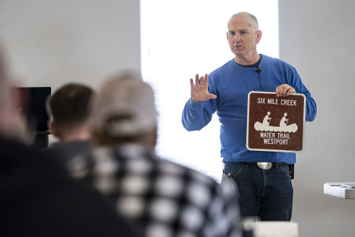 A man speaks to a crowd.