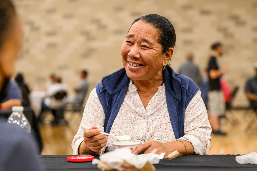 Custodian Ngodup Wangmo enjoys ice cream with colleagues.