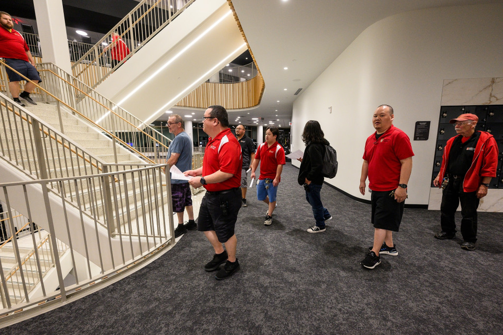 People tour a workout facility.