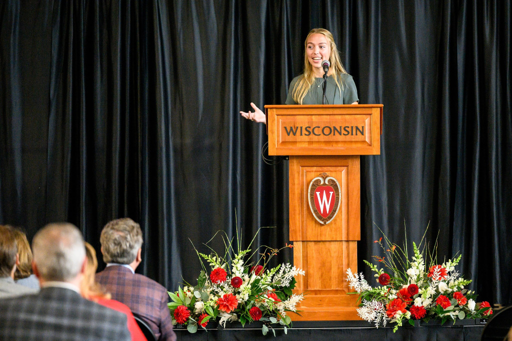 A woman speaks at a podium.