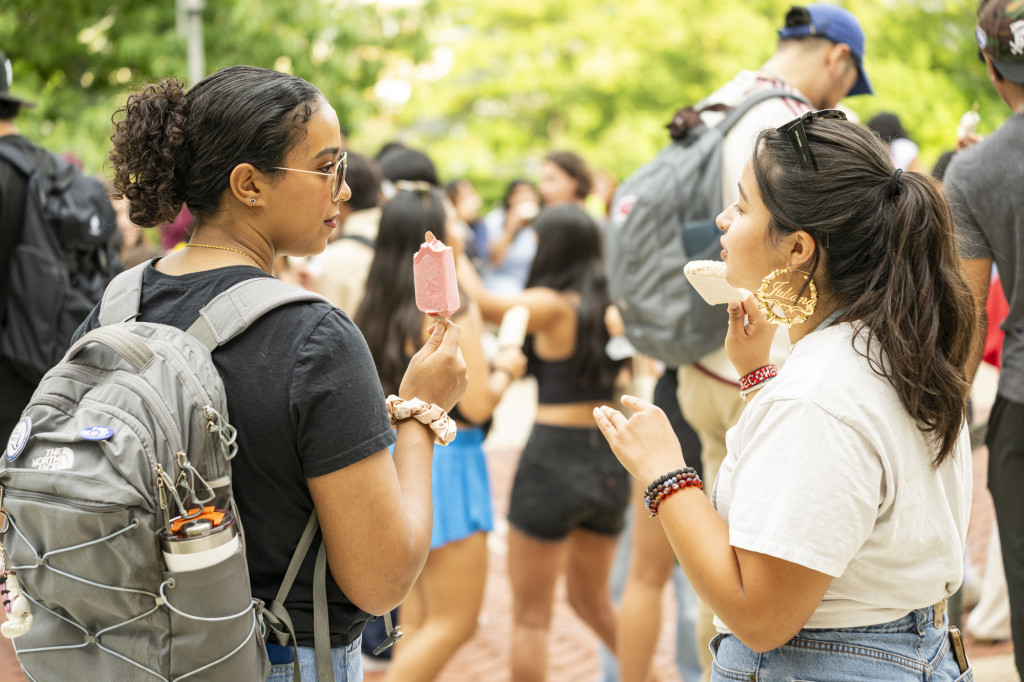 People smile while talking with each other.