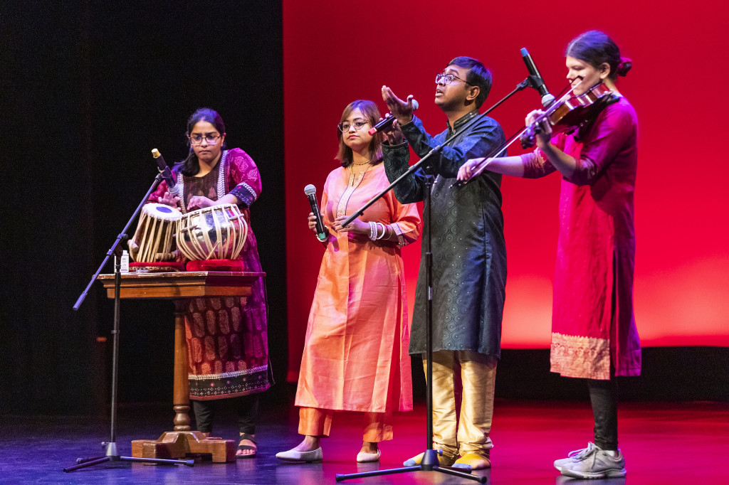 A group of people dance on stage.