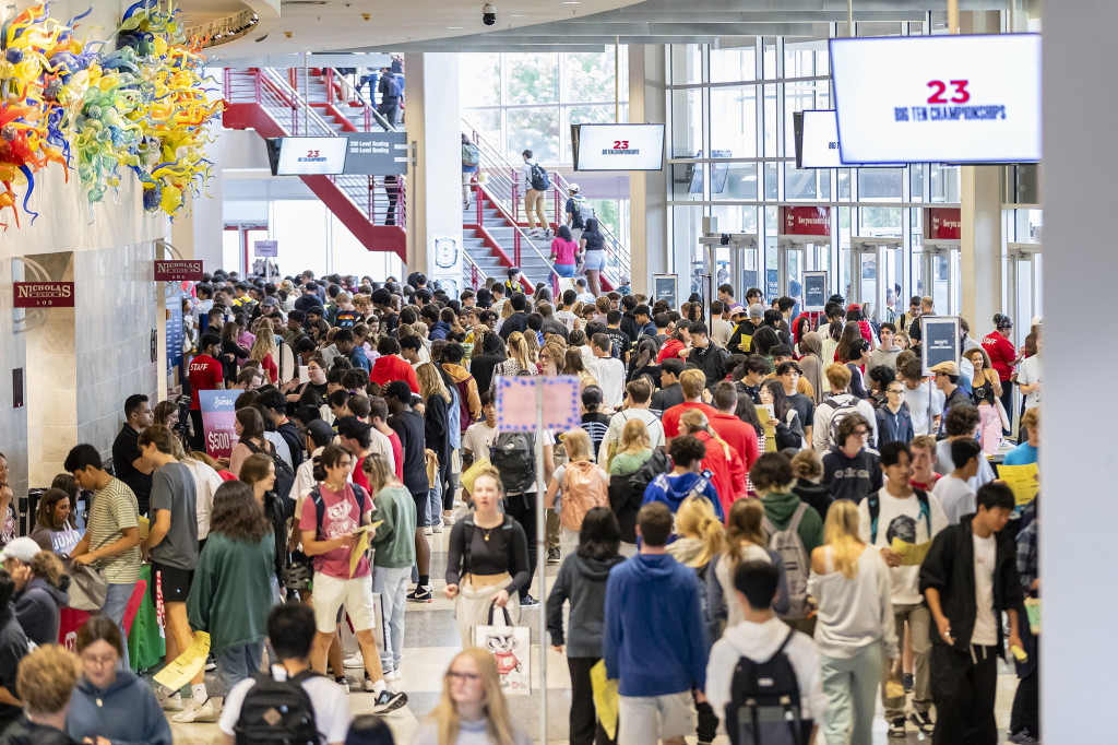 Students walk through the big hallways of the Kohl Center.