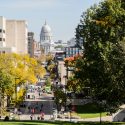 A view of the Wisconsin State Capitol taken from Bascom Hill. A long view up State Street toward the capitol building.