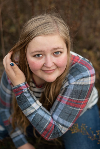 A portrait photo of Mattie Place looking up to the camera.