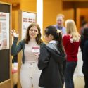 Christina Treacy, sustainability chair for the Associated Students of Madison (ASM), talks with attendees about the work of the ASM Sustainability Committee.