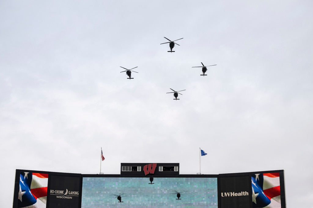 Helicopters appear over the horizon.