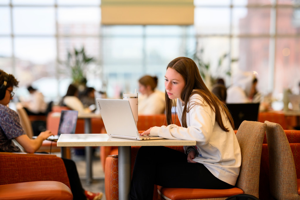 People study at a table.