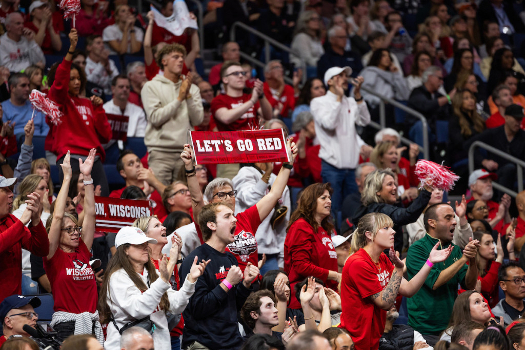 Fans in the stands cheer.