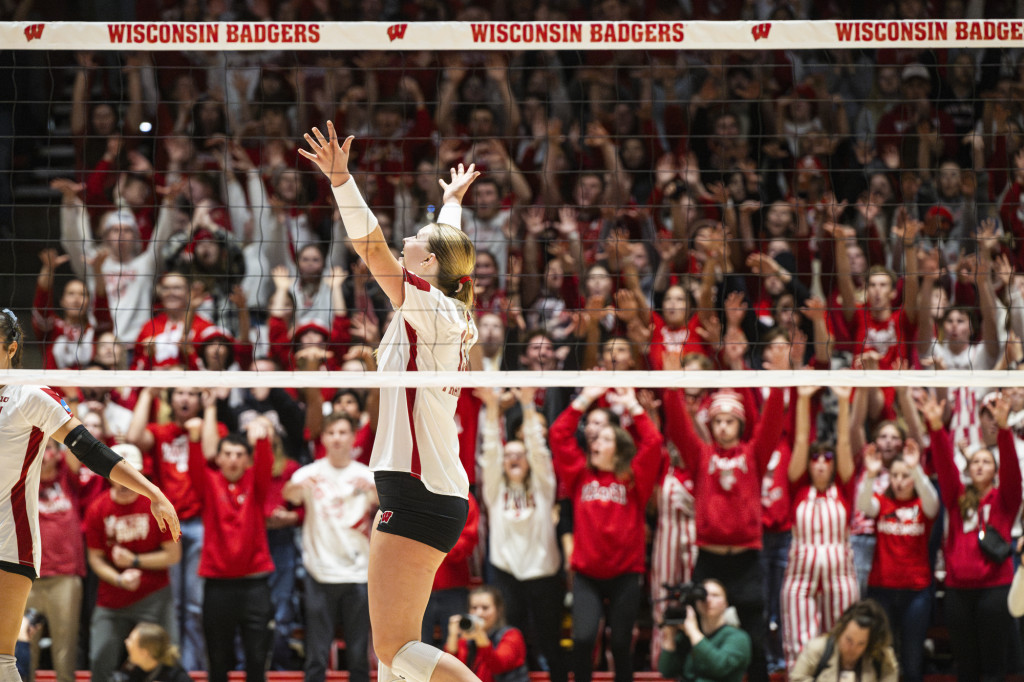 Sarah Franklin (13) celebrates with the crowd after scoring a point against Miami.