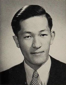 A black and white headshot photo of Miyoshi Ikawa