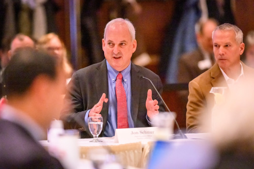 John Schnur speaks while gesturing with his hands.