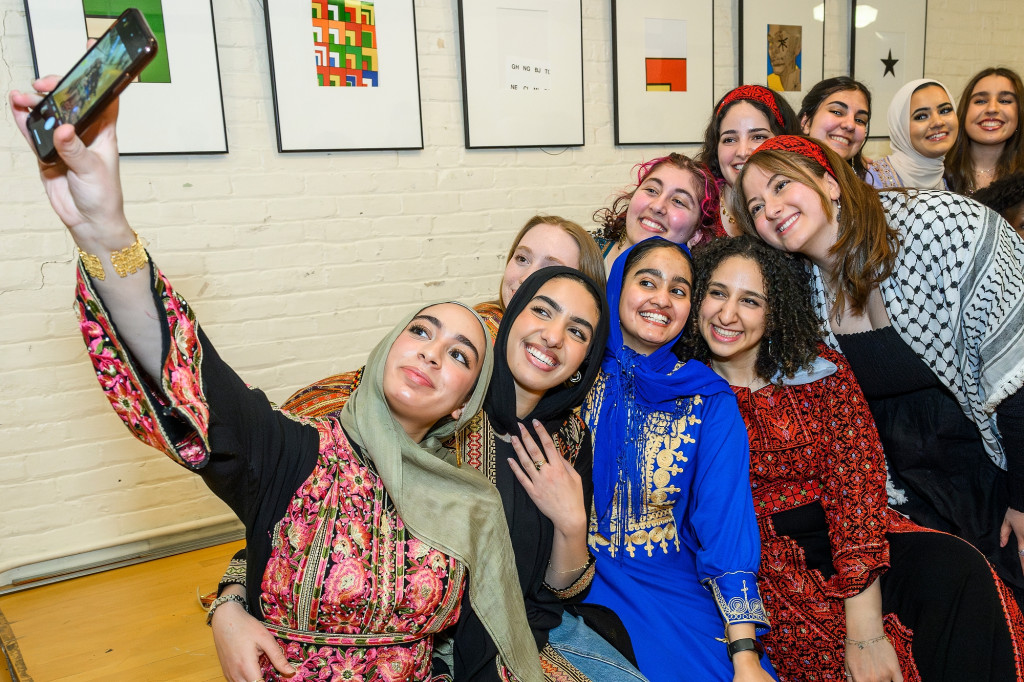 A group of people pose for a selfie.