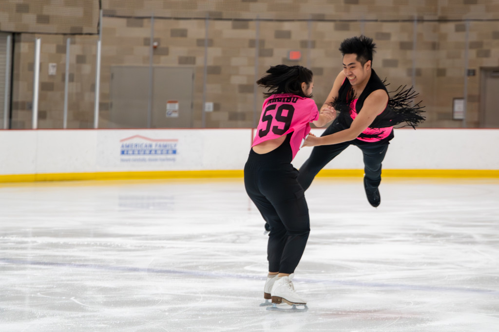 Angelina Huang (left) and Kevin Lee (right) skate together during the finale.
