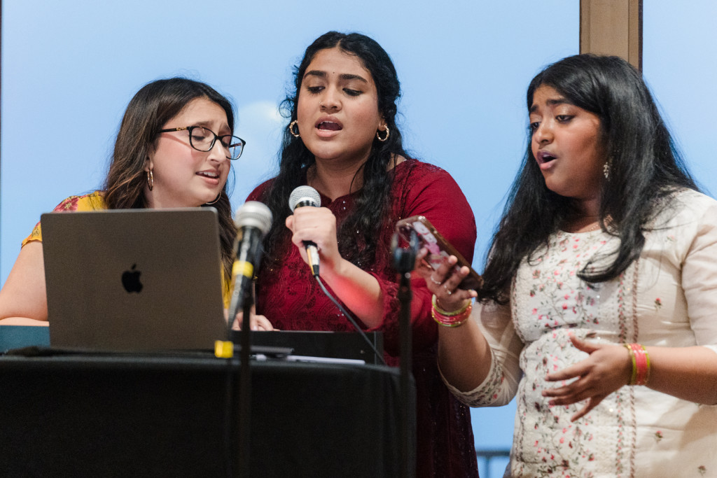 A trio of students performing as Kashmiri (Cush-merri) Chai performs DESI-English mash-ups during the Gala.  