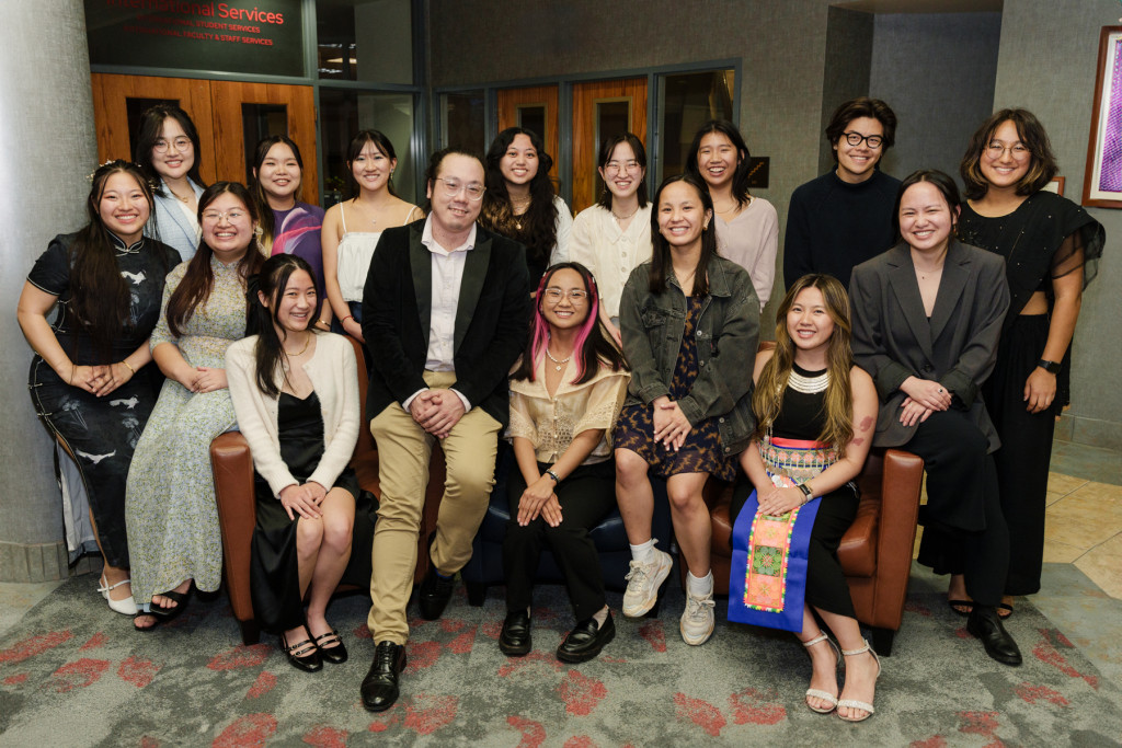 Members of the APIDA Heritage Month Planning Committee gather for a photo with Kevin Wong (front, center), program coordinator of the Asian Pacific Islander Desi American Student Center.  