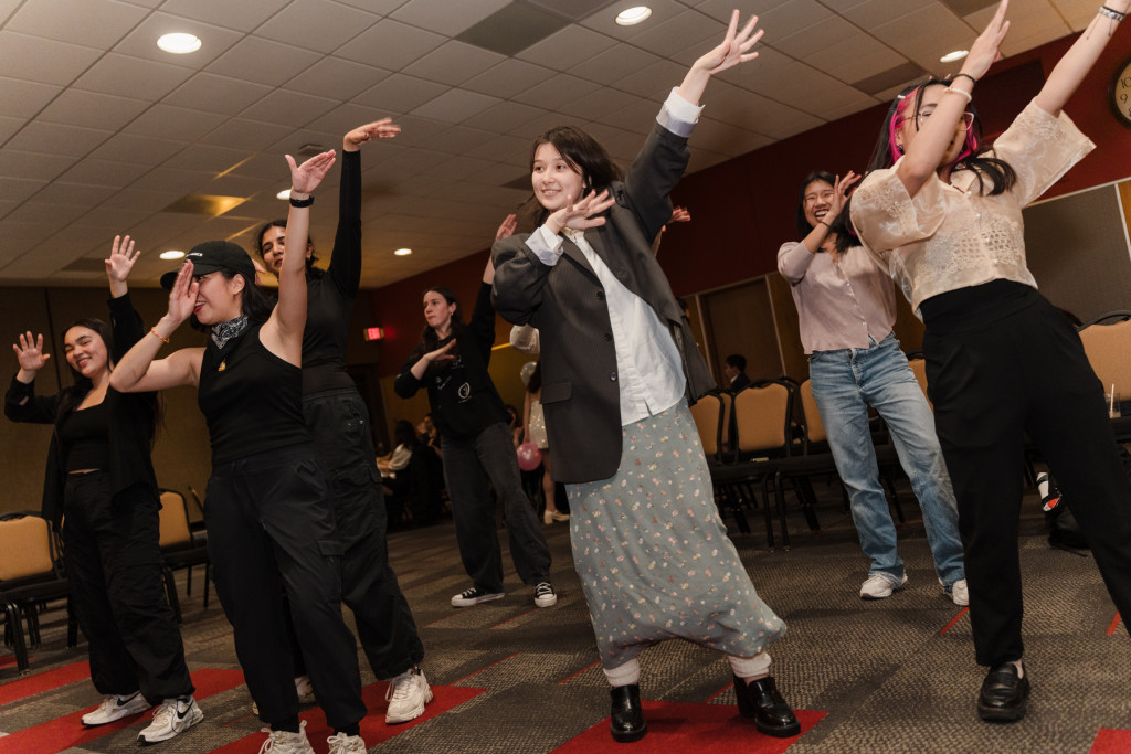 Students hit the floor for a coordinated dance performance.  