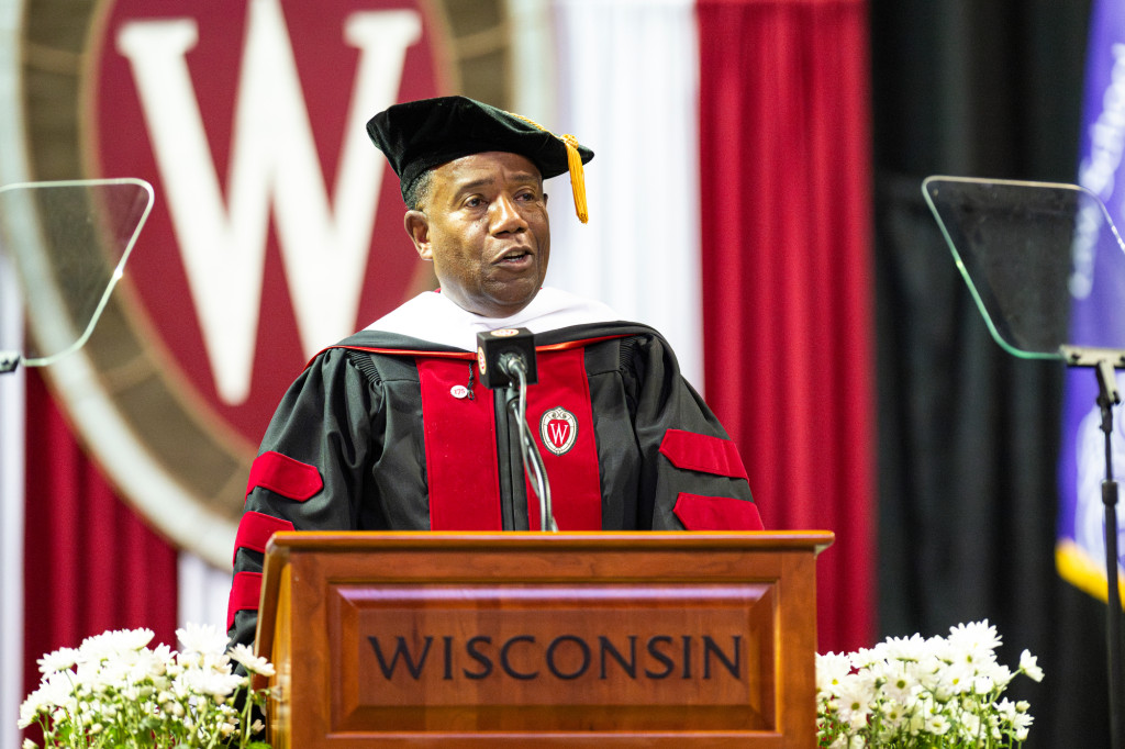 A man at a podium speaks.