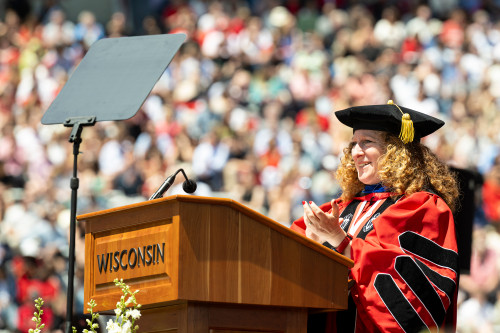 A woman speaks at a podium.