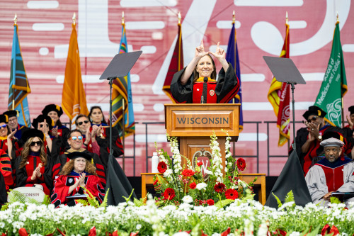 A woman speaks at a podium.