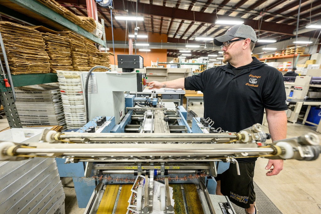 A man operates some machinery.