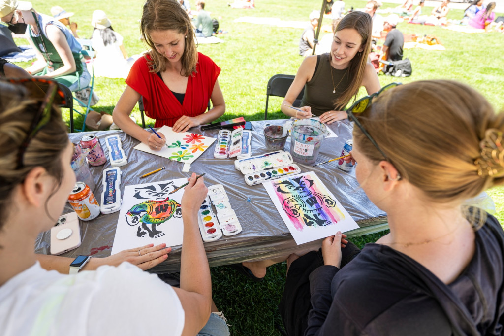 Attendees Olivia Kossel, Melissa Heilman, Katie Peters and Jill Heilman (front left to back right) enjoy watercolor painting with Wheelhouse Studios.