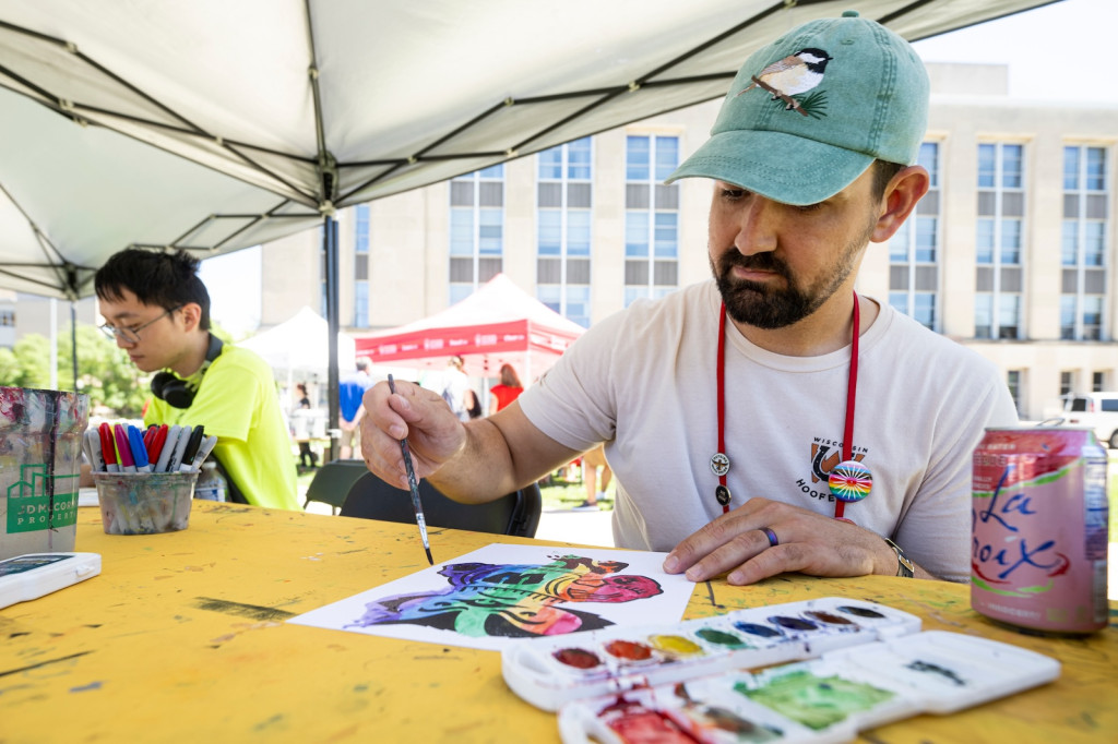 A man paints with watercolors.